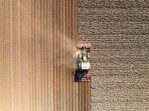 Tractor preparing the soil for planting crops