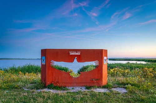 Cast iron work in the National Park Lauwersmeer, Netherlands, with the silhouette of a European Eagl