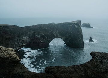 Arch in iceland near black sand beach by Thomas Kuipers