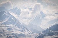 Snow, mountains and sun on top of the glacier