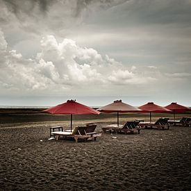 Deserted deckchairs under threatening skies by Frank Photos