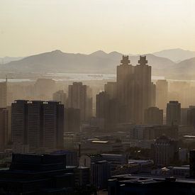 Sunset smog Pyongyang by Harold de Groot