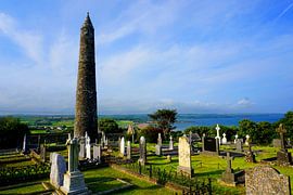 Old Cemetery with round Tower of the mystical Rock of Cashel, Ireland by Thomas Zacharias