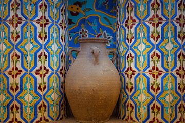 Pottery jug in niche with mosaic tiles