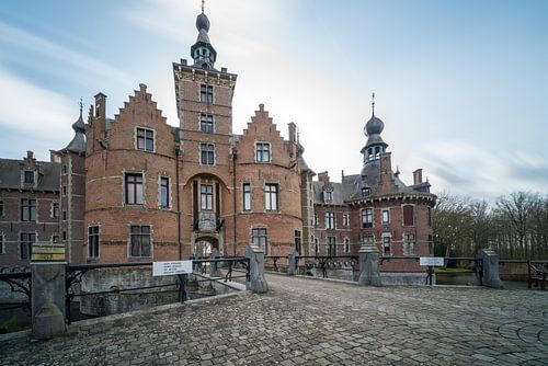 On a cloudy day near a beautiful and large castle