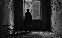 Man standing at the window by Frank Herrmann thumbnail