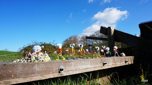 Row of Fubby's bringing daisies to the monster in a parade.