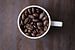 Koffiebonen in koffiekopje 11452159 van BeeldigBeeld Food & Lifestyle
