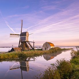 Polder landscape with fog and windmill by Menno van der Haven