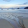 Zonsondergang bij  het strand van Kaiteriteri in Nieuw Zeeland van Aagje de Jong