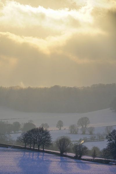 Sunbeams over winter landscape by The Book of Wandering