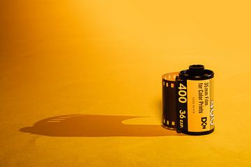 Film roll on yellow with drop shadow