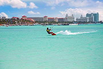 Kite surfing on the Caribbean Sea at Palm Beach on Aruba by Eye on You