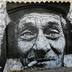 Street Art of a smoking man in Lagos- Portugal by Ineke de Rijk