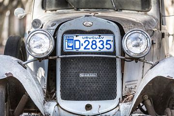 White classic A-Ford 1931 with grill and headlights in the streets of Colonia del Sacramento, Urugua by Jan van Dasler