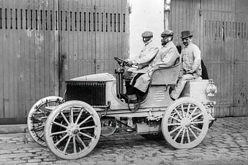 Three men with dust goggles in an automobile
