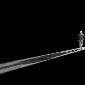 Construction worker on the move (selfie in black and white) by Lieven Tomme
