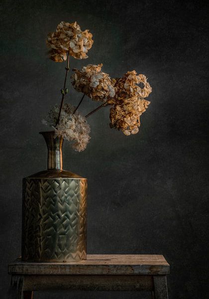 Still life with golden vase against a dark background by Joey Hohage