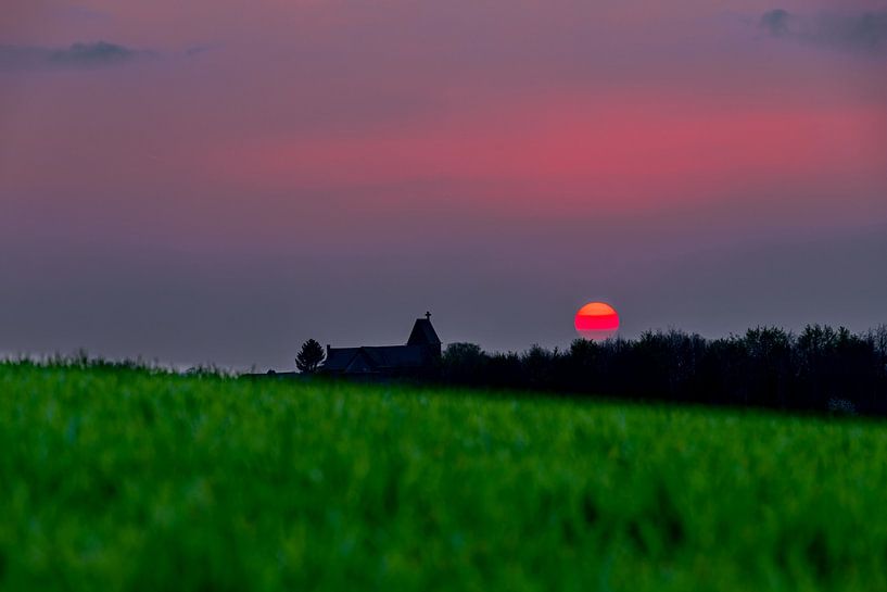 spectacular red sunset with a red ball of fire as the sun by Kim Willems