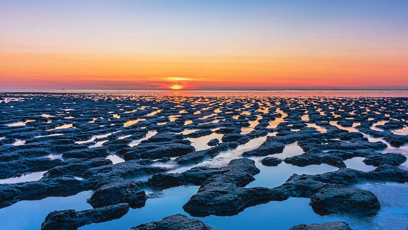 Sunset over the mudflats by Jaap v Bijsterveldt