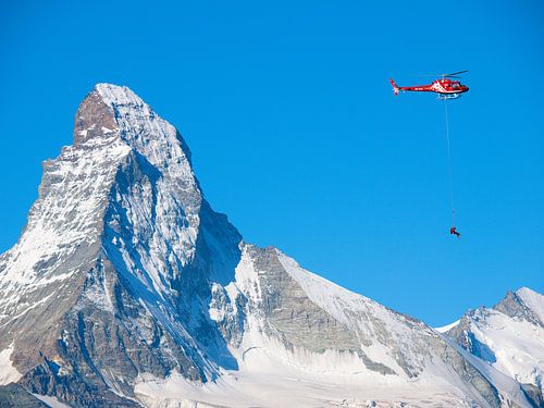 Rescue helicopter and Matterhorn by Menno Boermans