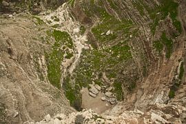 View to the bottom of the abyss from the monastery of temptation in Jericho, the place where accordi by Michael Semenov