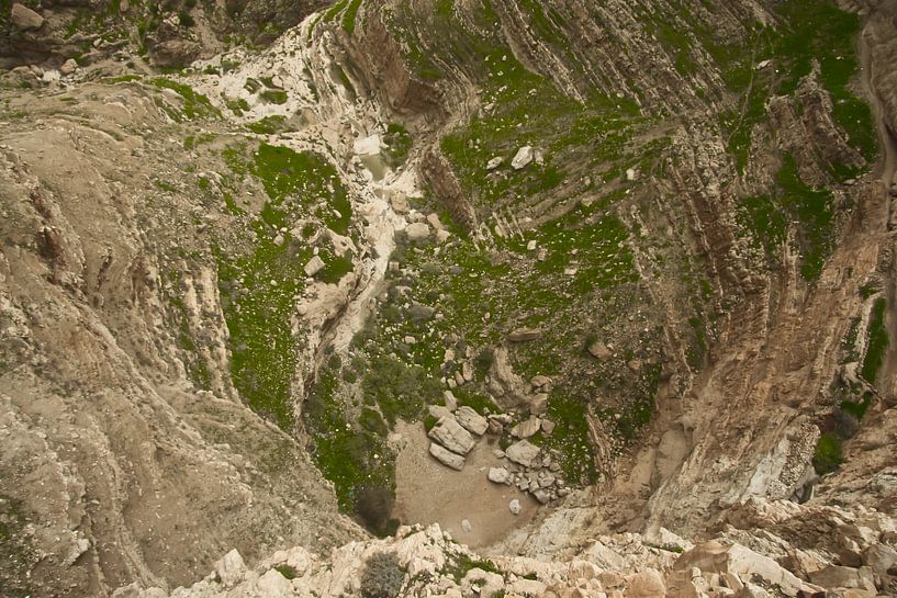View to the bottom of the abyss from the monastery of temptation in Jericho, the place where accordi by Michael Semenov