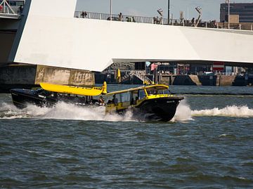 Water taxi's in action in front of the Erasmus Bridge Rotterdam by scheepskijkerhavenfotografie