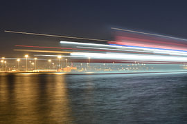 A ghost ship at night as it sets sail from the port of Heraklion
