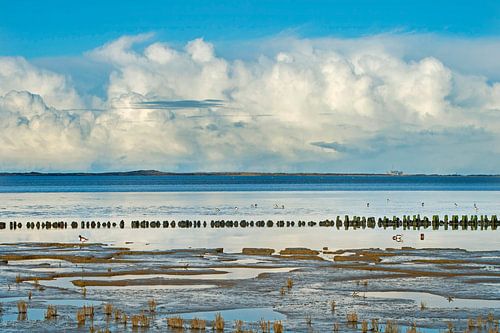 Clouds over Wadden Sea near Holwerd during low tide