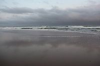 Clouds over Calm Seas at the Start of a gray Day