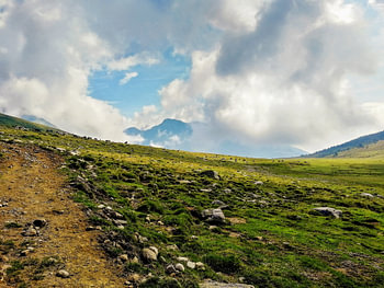 Alpine Pasture and Winding Trail in the Italian High Mountains