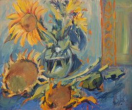 Sunflowers fresh and ripened with vase