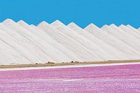 Landscape of white mountains of salt with pink salt lake on Bonaire