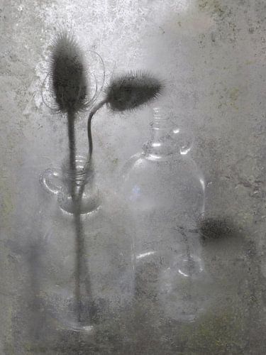 Still life glass bottles with candle ball