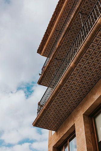 Colored tiles under balcony in downtown Jávea. Alicante, Spain