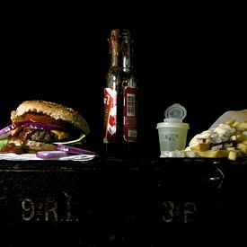 Picture of a still life with hamburger and french fries. by Therese Brals