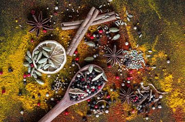 Spices and herbs for stew on a wooden spoon by Ricardo Bouman Photography