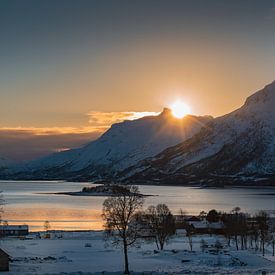 Sunset with reflextion on frozen water of the fjord by Erwin Floor