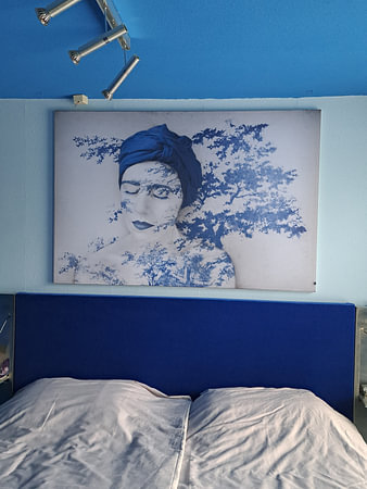 Botanist in Delft Blue – a serene portrait in cobalt blue