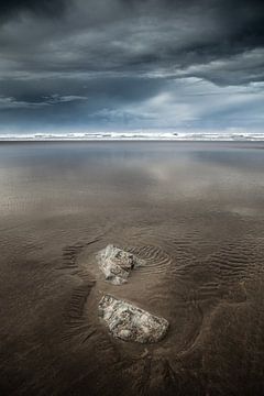 Rocks on the beach of Casablanca in Morocco after a storm by Bas Meelker