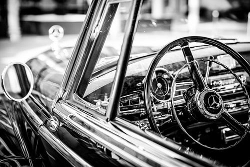 Vintage Mercedes interior with steering wheel and bonnet ornament