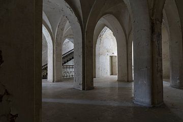 Hallway in dilapidated monastery with arches and staircase by Leoniek van der Vliet