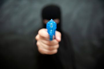 Criminal with water pistol