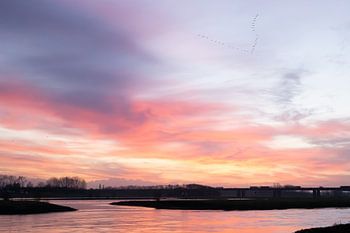 Zonsopkomst aan het water