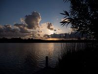 Sunset on a waterway in the Netherlands with dramatic clouds