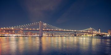 Brooklyn Bridge over East River in New York City at night by Robert Ruidl