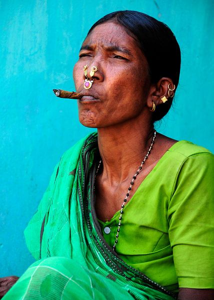 Cigar-smoking wife of one of India's adivasi. by Ton Bijvank