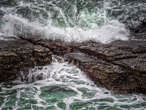 Waves break on a rocky shore