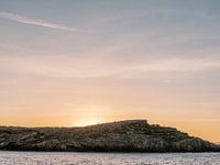 Walk over the rocks during the sunset on Ibiza